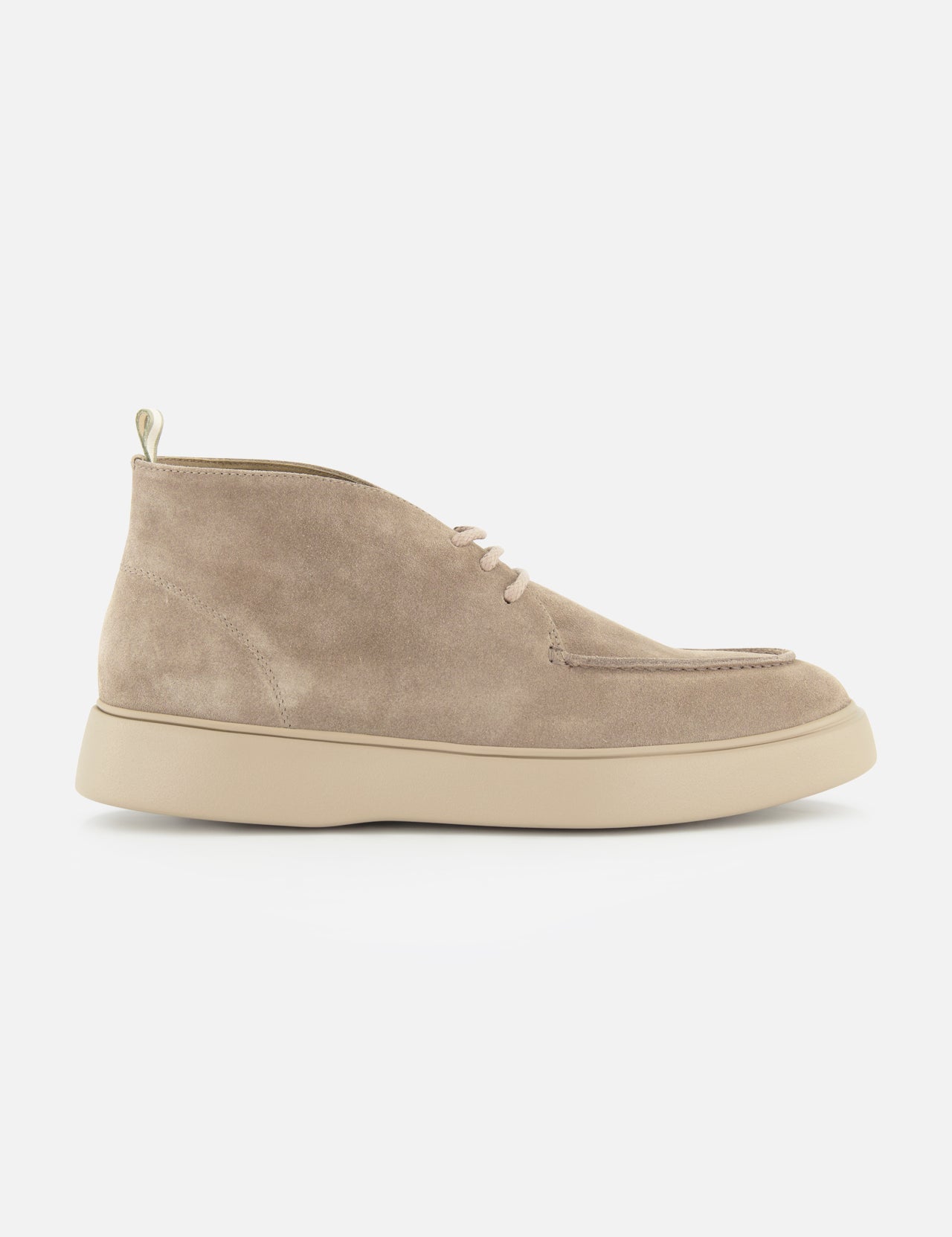 The Frame Suede Lace Chukka Boot by OFFICINE CREATIVE is a beige suede chukka boot, handmade in Italy, featuring a rounded toe, lace-up front, and a light-colored thick rubber sole, displayed in a side view on a plain white background.