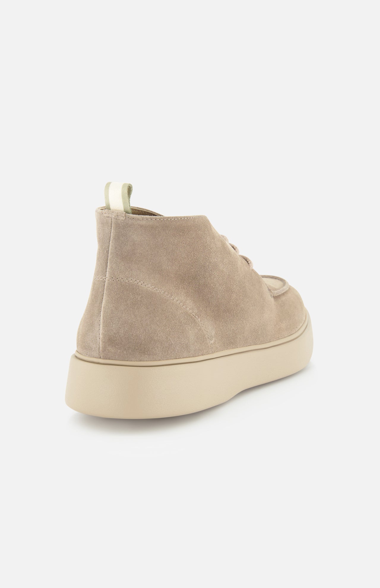The OFFICINE CREATIVE Frame Suede Lace Chukka Boot, crafted in beige suede, showcases a refined chukka-inspired silhouette with a chunky, light-toned sole and is presented from a rear side angle against a plain white background.