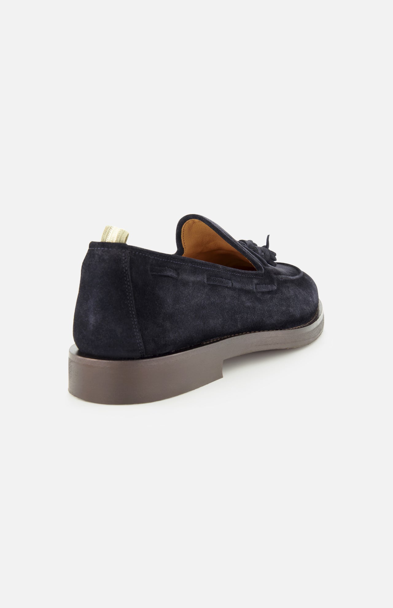 The OFFICINE CREATIVE Opera Flexi Tassel Loafer is shown from the rear left side on a white background, featuring dark suede with tassels, a tan interior, beige pull tab, and a thick grey sole.