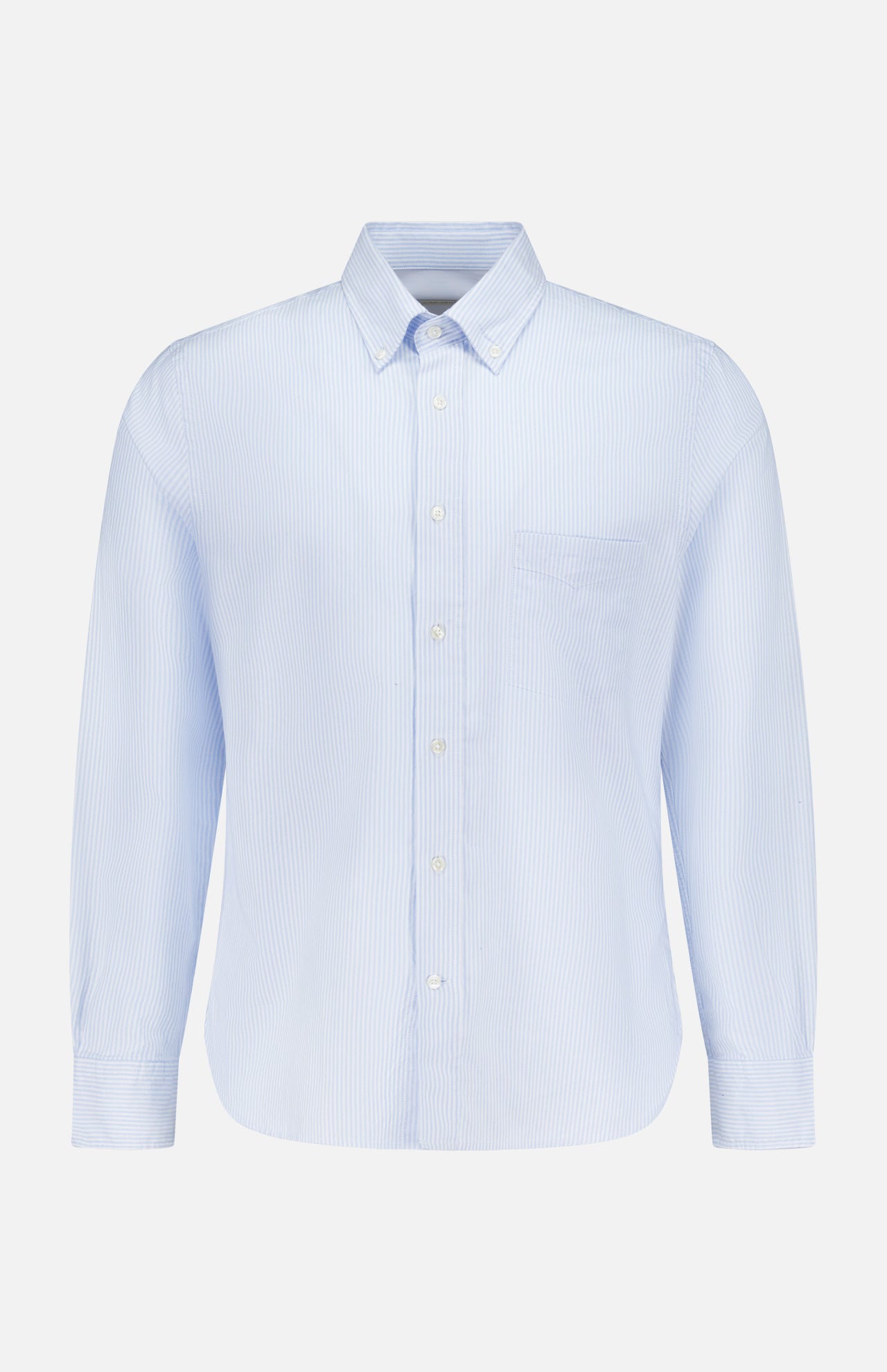 The Candy Stripe Oxford Shirt by OFFICINE GÉNÉRALE features light blue stripes, long sleeves, a classic collar, and chest pocket, crafted from fine Italian cotton for timeless Parisian style. Displayed on a plain white background.