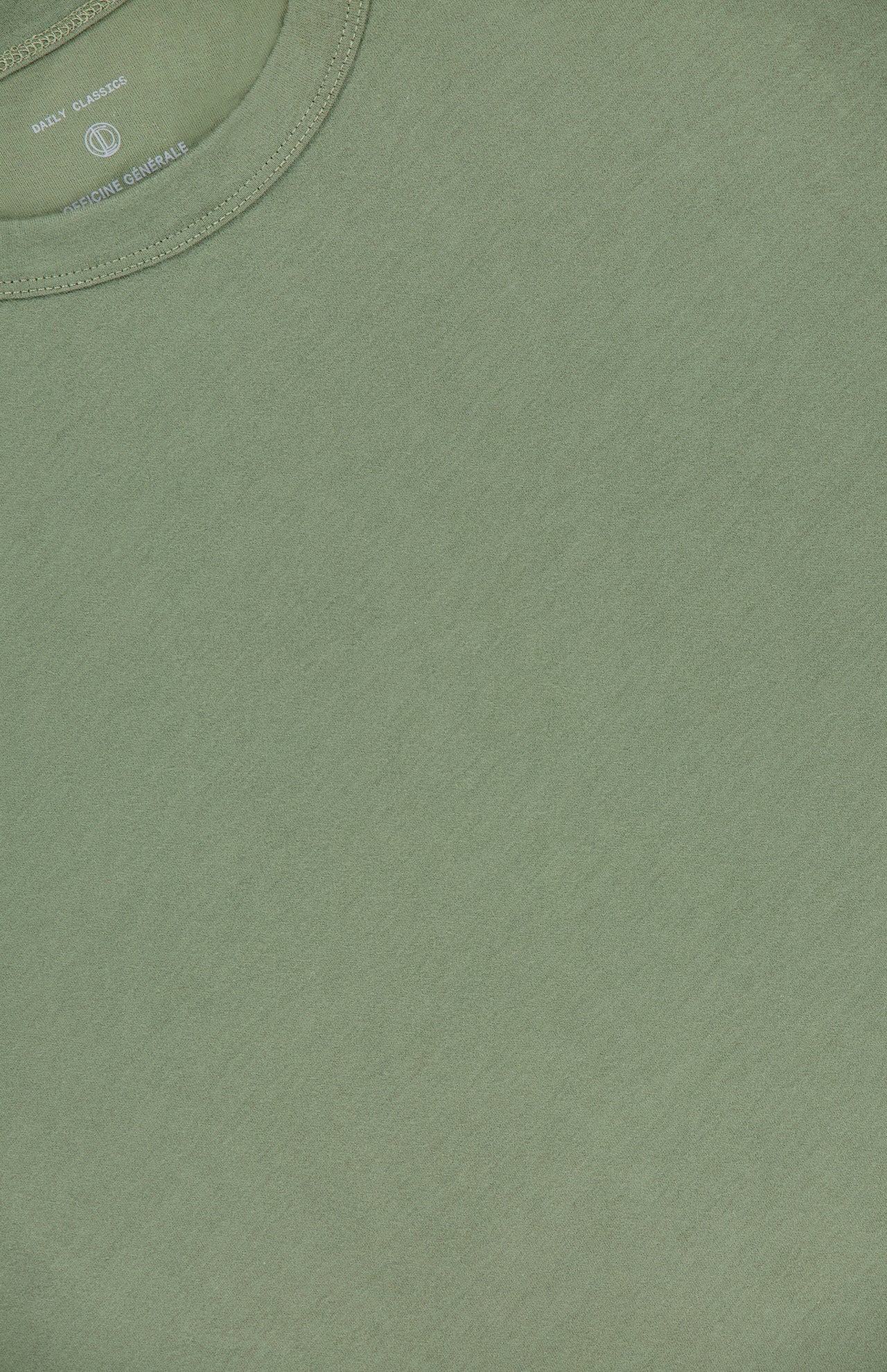 A close-up of the OFFICINE GÉNÉRALE Cotton Crewneck T-shirt in olive green organic cotton, showcasing its visible crew neck and subtle texture.
