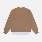A brown crew neck cotton sweatshirt is shown from the back over the OFFICINE GÉNÉRALE Darius Supro Stripe Shirt, its blue and white striped hem peeking out for a layered look against a plain white background.