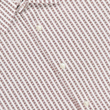 Close-up of the Gad Striped Shirt by OFFICINE GÉNÉRALE, featuring brown and white stripes, a small collar, and three white buttons. The OFFICINE GÉNÉRALE label appears at the neck for a refined casual style.