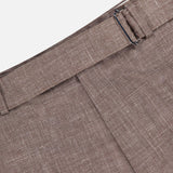 Close-up of the Hoche Poplin Trouser Pant by OFFICINE GÉNÉRALE in light brown, featuring a metal side adjuster and belt loop. Made from a refined wool, silk, and linen blend for superior comfort.