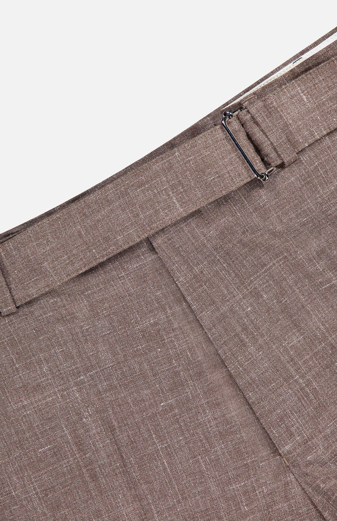 Close-up of the Hoche Poplin Trouser Pant by OFFICINE GÉNÉRALE in light brown, featuring a metal side adjuster and belt loop. Made from a refined wool, silk, and linen blend for superior comfort.