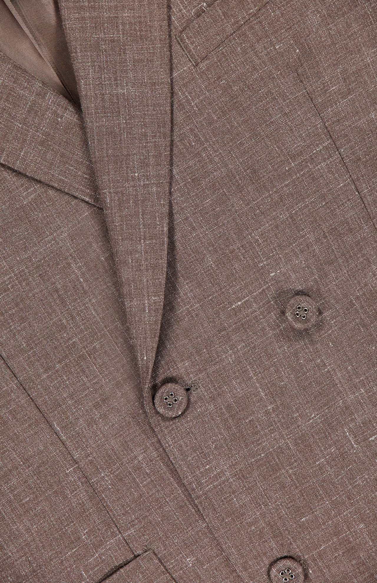 Close-up of the OFFICINE GÉNÉRALE Leon Double Breasted Poplin Blazer, showing the lapel, buttons, and pocket. The light brown fabric has a subtle crosshatch texture for added depth.