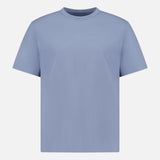 The OFFICINE GÉNÉRALE Cotton Crewneck T-Shirt is a plain, short-sleeved tee in light blue, crafted from soft organic cotton and shown on a white background.