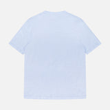 The Garment Dyed Linen Short Sleeve T-shirt by OFFICINE GÉNÉRALE, in light blue, is displayed from the back with short sleeves and breathable fabric, laid flat against a white background.