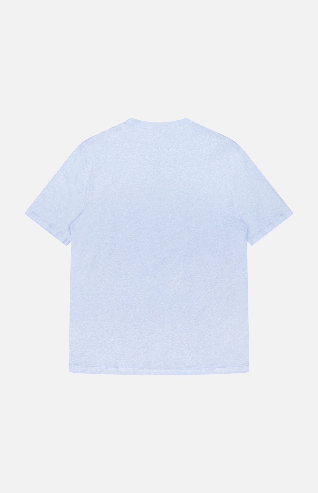 The Garment Dyed Linen Short Sleeve T-shirt by OFFICINE GÉNÉRALE, in light blue, is displayed from the back with short sleeves and breathable fabric, laid flat against a white background.