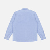 The OFFICINE GÉNÉRALE Guido Slub Cotton Shirt is a light blue, long-sleeve button-up with a classic collar, made from 100% cotton and shown from the back against a white background.