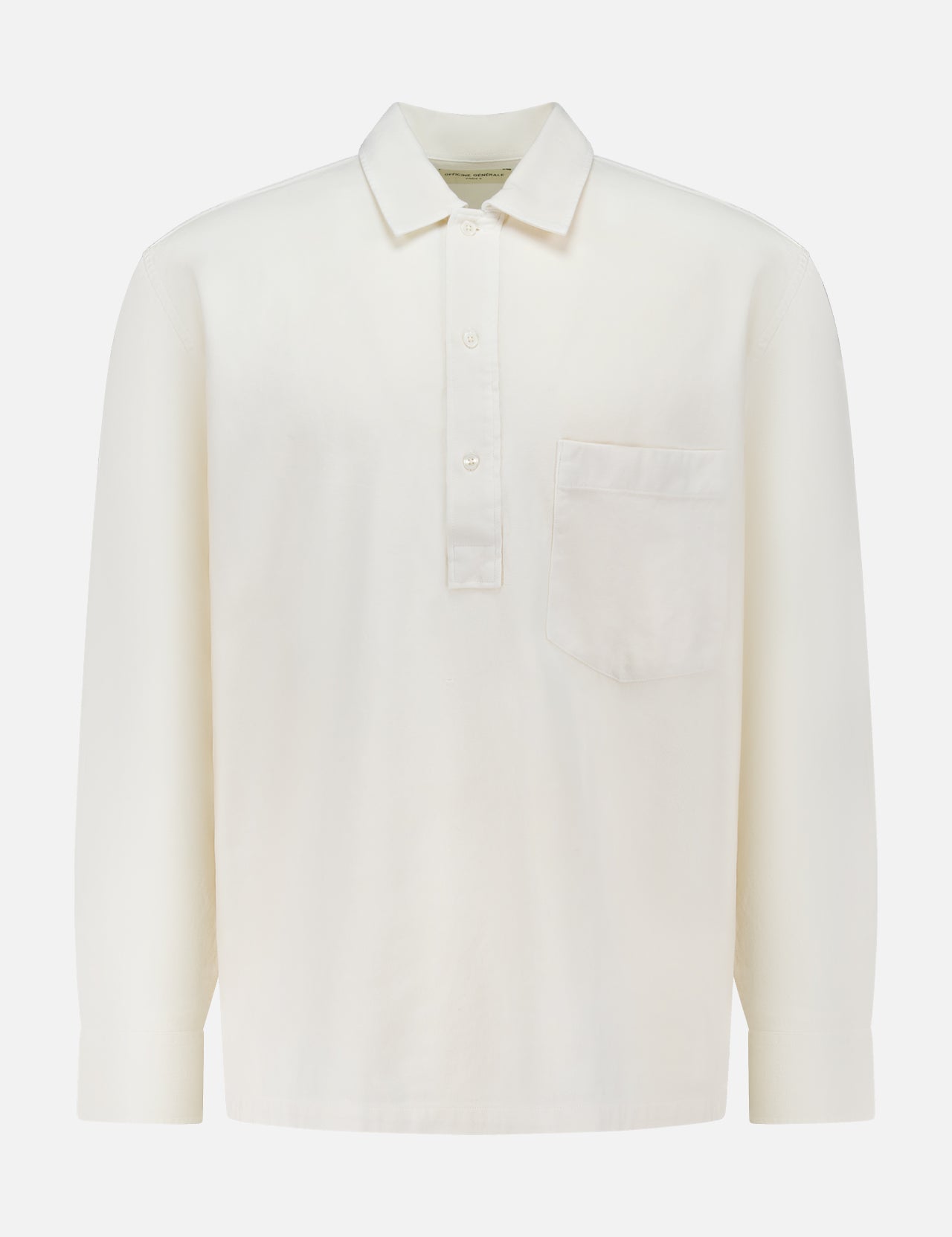 The OFFICINE GÉNÉRALE Jordy Pigment Brush Twill Long Sleeve Shirt is a plain white, loose fit shirt featuring long sleeves, a collar, three front buttons, and a single chest pocket, shown against a white background.
