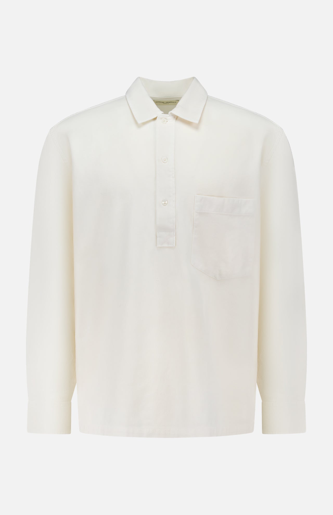 The OFFICINE GÉNÉRALE Jordy Pigment Brush Twill Long Sleeve Shirt is a plain white, loose fit shirt featuring long sleeves, a collar, three front buttons, and a single chest pocket, shown against a white background.