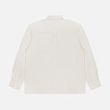 Back view of the Jordy Pigment Brush Twill Long Sleeve Shirt by OFFICINE GÉNÉRALE, crafted from cream cotton with a collar, single pleat at the upper back, long sleeves, and buttoned cuffs, displayed on a plain white background. This loose-fit shirt offers effortless style and comfort.