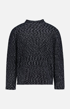 The OFFICINE GÉNÉRALE Riley Mockneck Sweater is a long-sleeved, dark gray and black marled knit sweater featuring a high neckline and relaxed fit, channeling a Parisian-inspired style and shown against a plain white background.