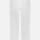 Back view of OFFICINE GÉNÉRALE Vintage Original Wash Denim Pants, featuring vintage wash denim, two back pockets, brown leather waistband patch, and classic 5-pocket design.