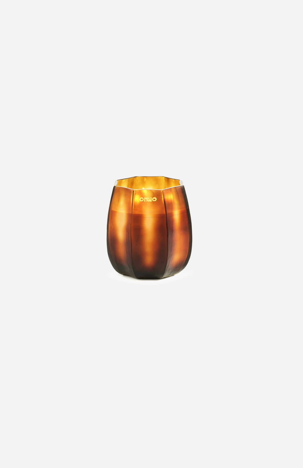 Centered on a plain white background, the ONNO Embrace S Sage Candle glows in its round, amber glass holder with a glossy finish—a luxury scented addition to elevate your home fragrance collection.