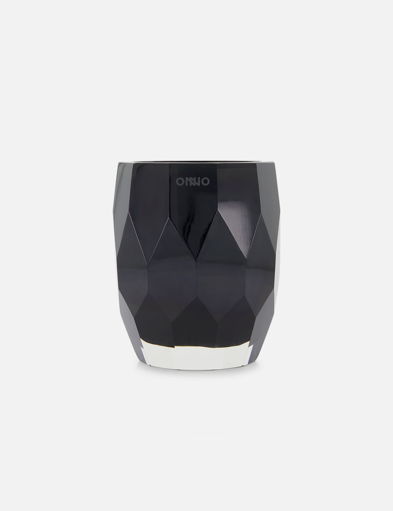 The ONNO Jewel Black M Escape is a faceted, glossy black candle holder with a geometric design and wide opening, ideal for displaying luxury or hand-poured candles. Shown on a plain light grey background.