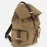 The ORCIANI Safari Leather Trim Backpack features khaki canvas, brown leather straps, a front buckle pocket, side pocket, and top flap closure. This men’s backpack stands upright on a white background.