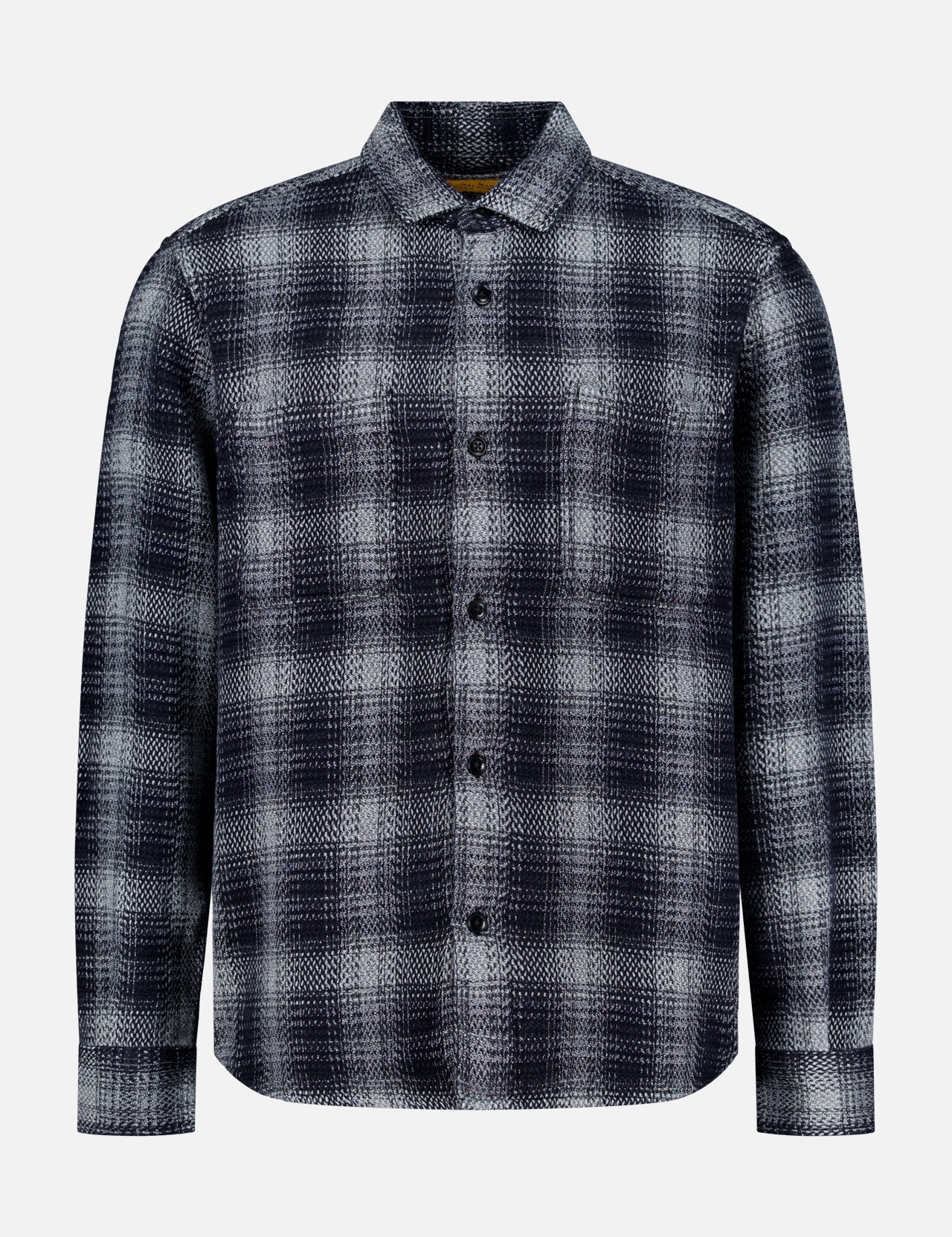The ORIGINAL MADRAS Check Roundtail Overshirt is a men’s long-sleeve, button-up shirt in a black, gray, and white plaid cotton pattern. Featuring a chest pocket and classic collar, this easy-care overshirt is displayed against a plain white background.