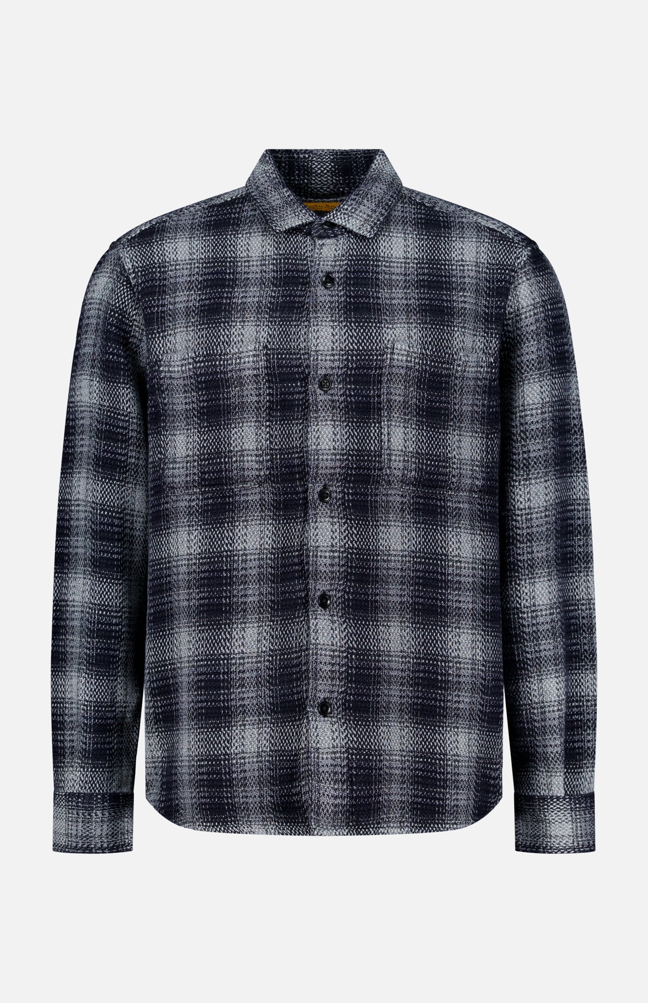 The ORIGINAL MADRAS Check Roundtail Overshirt is a men’s long-sleeve, button-up shirt in a black, gray, and white plaid cotton pattern. Featuring a chest pocket and classic collar, this easy-care overshirt is displayed against a plain white background.