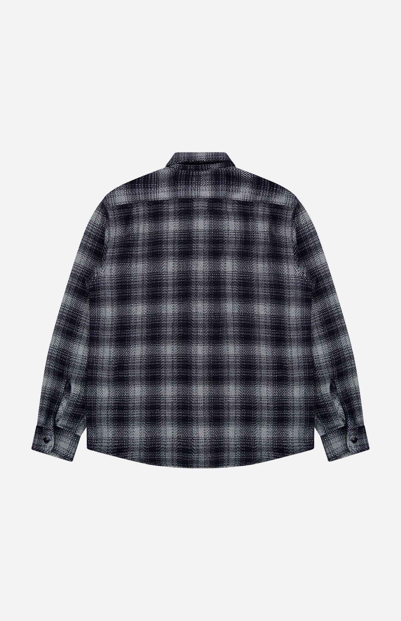 The ORIGINAL MADRAS Check Roundtail Overshirt, crafted from black and white plaid cotton, is laid flat with its back facing up. This men’s easy-care shirt features a classic collar and buttoned cuffs, shown against a plain white background.