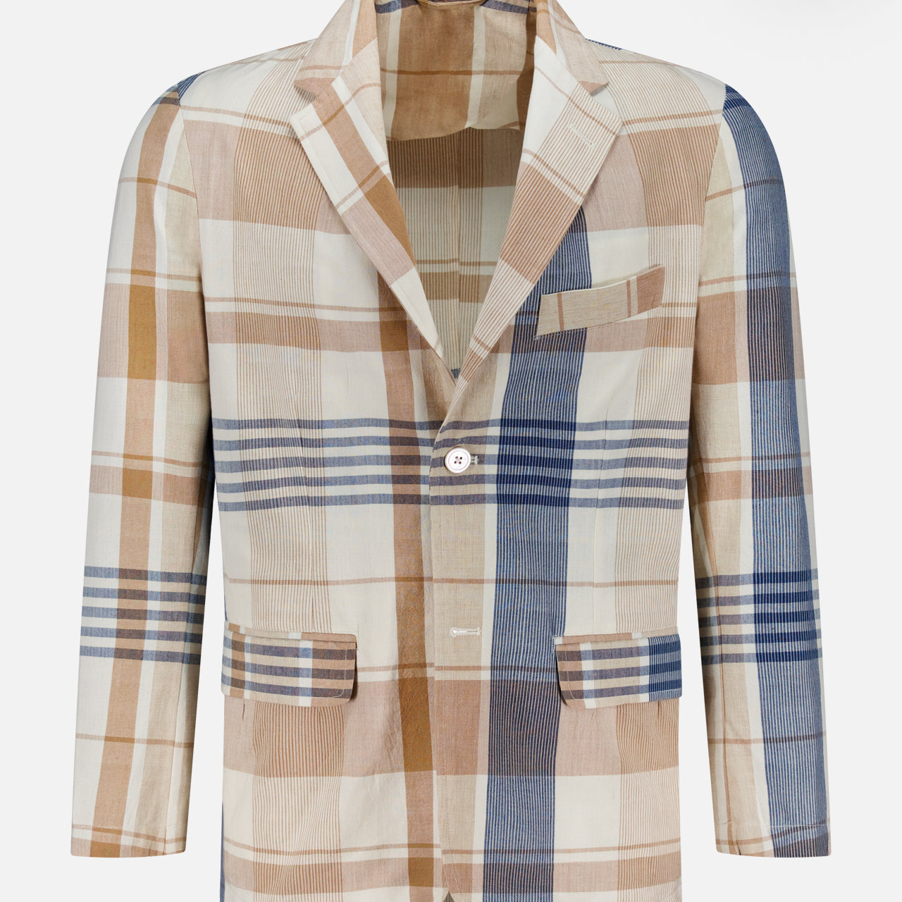 The ORIGINAL MADRAS Check Single Breasted Summer Jacket is a men's blazer in a patchwork Madras check of beige, brown, blue, and cream. Made from Indian cotton, it features notched lapels, two front buttons, and multiple pockets.