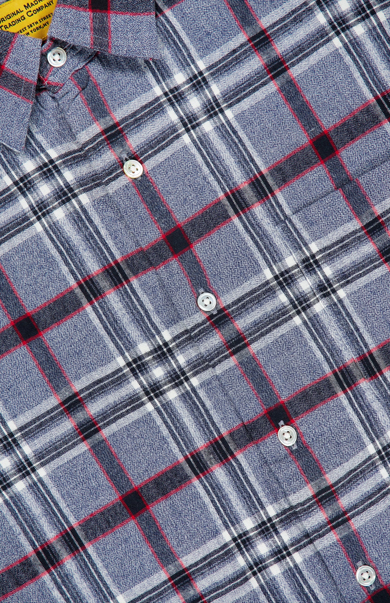 Here’s a rewritten sentence using the product data: Close-up of the ORIGINAL MADRAS Check Straight Collar Dress Shirt, showcasing its blue, gray, black, and red Madras check pattern in pure Indian cotton with white buttons and a partial view of the collar.