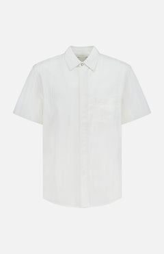 The ORIGINAL MADRAS Seersucker Snap Fly Lax Short Sleeve Shirt features a collar, single chest pocket, and lightweight white seersucker fabric—ideal for spring wear. Displayed on a white background.