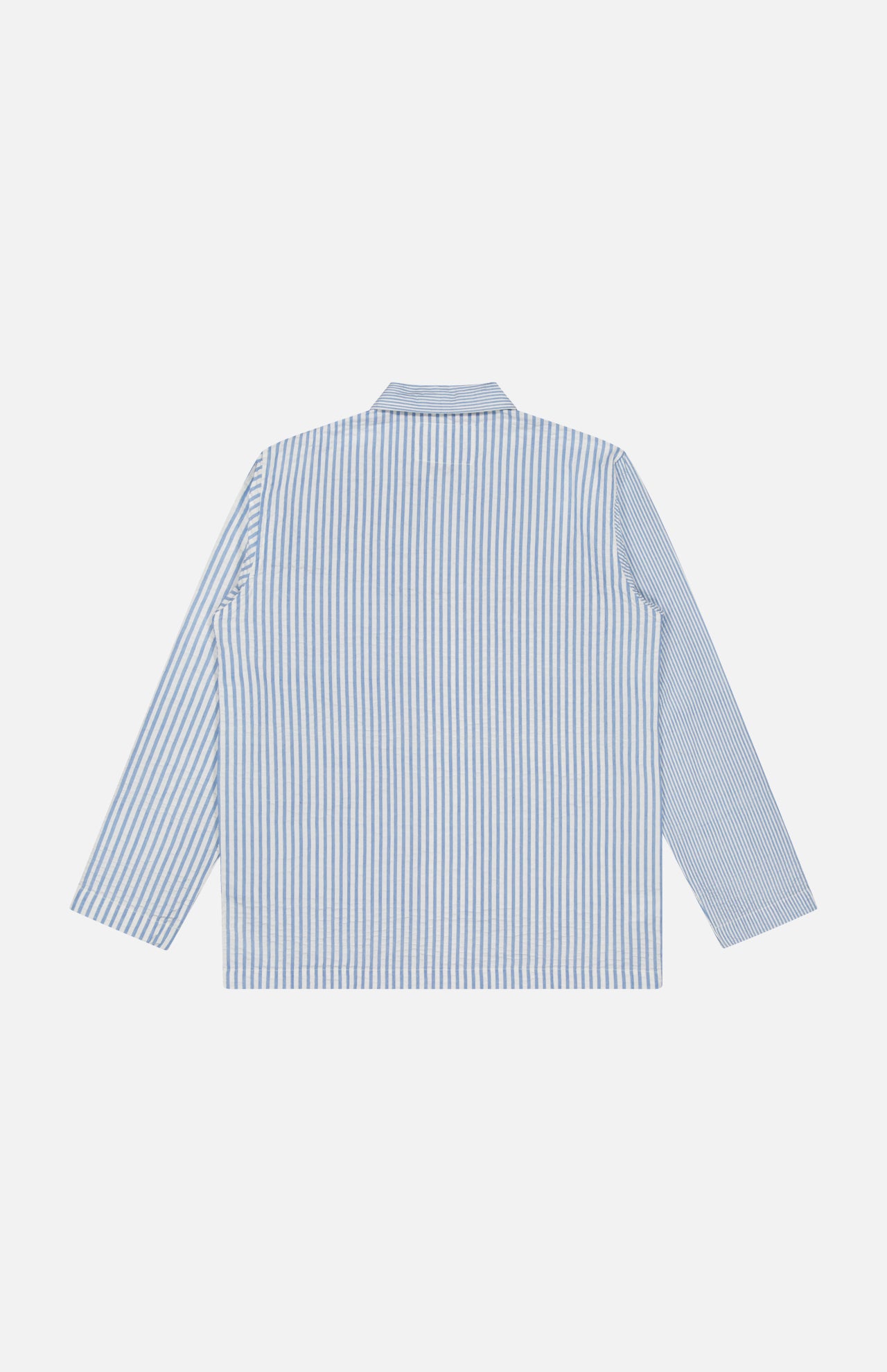 The ORIGINAL MADRAS Seersucker Stripe Shirt Jacket, in blue and white stripes and soft cotton, is shown laid flat with its back up against a plain white background—a versatile piece perfect for layering.