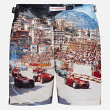 ORLEBAR BROWN Bulldog Photographic Race Car Shorts feature a vivid Grand Prix de Monaco print with classic race cars speeding past grandstands, city buildings, and mountains in the background.