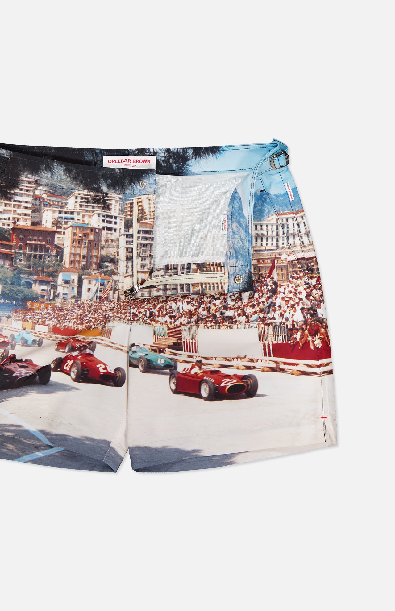 ORLEBAR BROWN’s Bulldog Photographic Race Car Shorts feature a vintage Grand Prix de Monaco photo print with classic cars racing past city buildings and enthusiastic crowds.