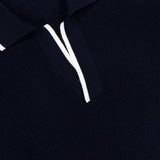 Close-up of the ORLEBAR BROWN Horton Stripe Johnny Collar Polo, featuring a Johnny collar with white trim along the collar and opening. A visible ORLEBAR BROWN label appears at the top.