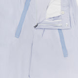 Alex Relaxed Linen Pants by ORLEBAR BROWN in light blue feature a relaxed fit, elastic drawstring waist with visible blue ties, partially open zip fly, inner lining, button fastening, and part of the brand label at the top.