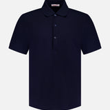 The ORLEBAR BROWN Bruno 3 Button Pique Polo Shirt is a classic fit, short-sleeved navy blue cotton polo with a collar and three-button placket, shown on a white background.