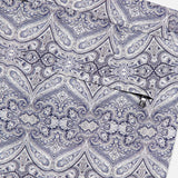 The ORLEBAR BROWN Bulldog Carnival Swim Trunk features a detailed paisley print in blue and gray, complete with a small horizontal zippered pocket.