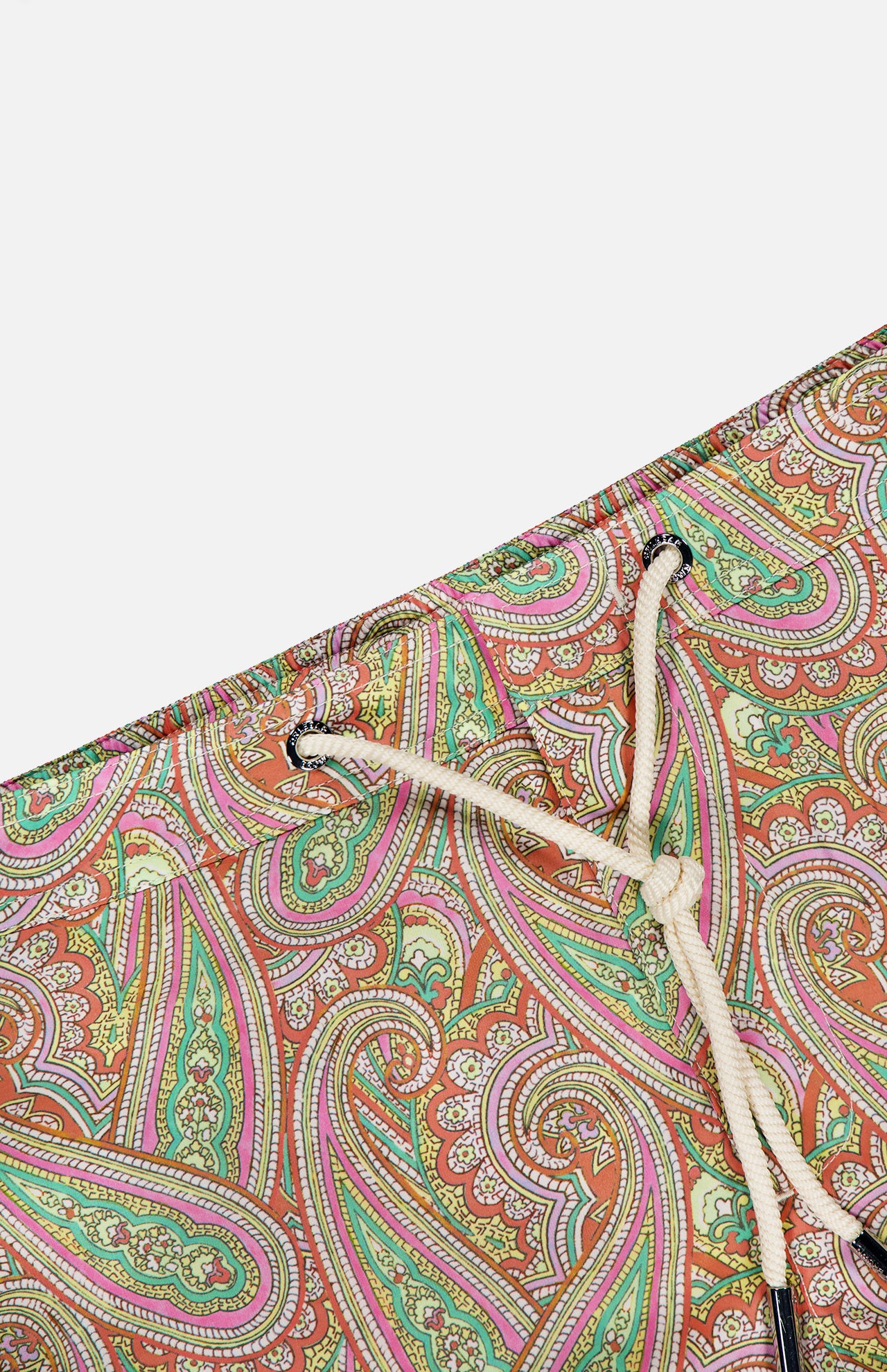 Close-up of ORLEBAR BROWN Bulldog Drawcord Carnival Paisley Swim Shorts: vibrant paisley print swim trunks with a white drawstring, featuring bold green, pink, and orange swirls on a crisp white background.