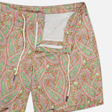 ORLEBAR BROWN Bulldog Drawcord Carnival Paisley Swim Shorts for men feature a vibrant red, green, and orange paisley print, cream drawstring, partially open fly with white mesh lining, shown on a plain white background.