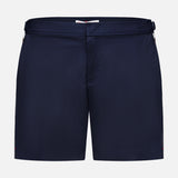 ORLEBAR BROWN Bulldog Stretch Shorts: navy men's swim trunks with a flat front, waistband, and adjustable side tabs, featuring a classic, unbranded style and no patterns. Shown on a plain white background.