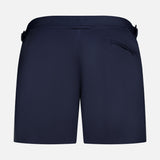 Back view of ORLEBAR BROWN Bulldog Stretch Shorts in navy, featuring an adjustable waistband, side tabs, and a right zip pocket, shown against a plain white background.