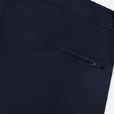 Close-up of ORLEBAR BROWN Bulldog Stretch Shorts in navy, showcasing a single welt button pocket, clean stitching, and adjustable side tabs for a tailored fit.
