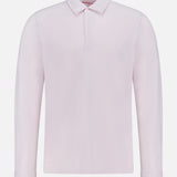 The ORLEBAR BROWN Garfield Long Sleeve Polo Shirt, crafted in Portugal from premium cotton pique jersey, features a light pink hue, classic collar, and three buttons, shown here against a plain white background.