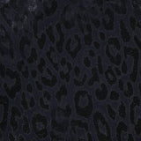 Close-up of the PAMELLA ROLAND Lurex Jacquard Mini Dress in black, showcasing a subtle leopard print with dark spots and a slightly shiny, textured finish—ideal for a chic, animal-inspired look.