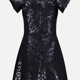 The PAMELLA ROLAND Lurex Jacquard Mini Dress features a black metallic leopard print, oversized puff sleeves, a fitted bodice, and a softly flared skirt with all-over shimmer.