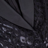 Close-up of the PAMELLA ROLAND Lurex Jacquard Leopard Print Jacket featuring a shiny, subtle leopard pattern, fabric-covered buttons, and a smooth black lapel.