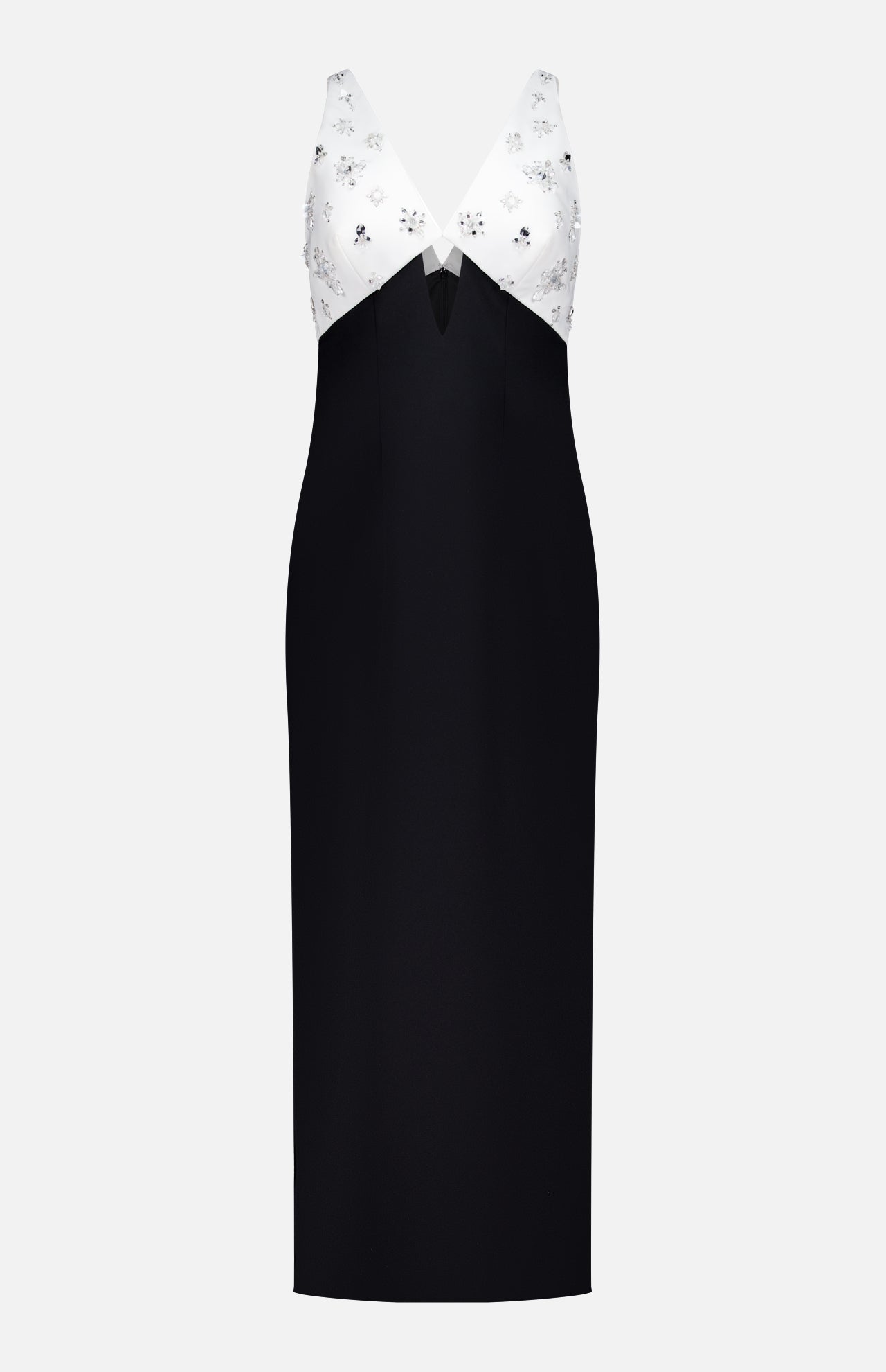 The Crystal Embroidered Crepe Gown by PAMELLA ROLAND features a sleeveless design with a fitted black skirt, white V-neck bodice adorned with subtle florals, and a stylish triangular cutout—ideal for chic special occasions.