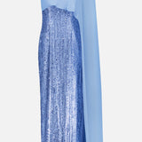 The PAMELLA ROLAND Chiffon Overlay Sequin Gown features a shimmering sky blue hue, one-shoulder design with a sheer flowing sleeve, and fitted silhouette—ideal for formal occasions.