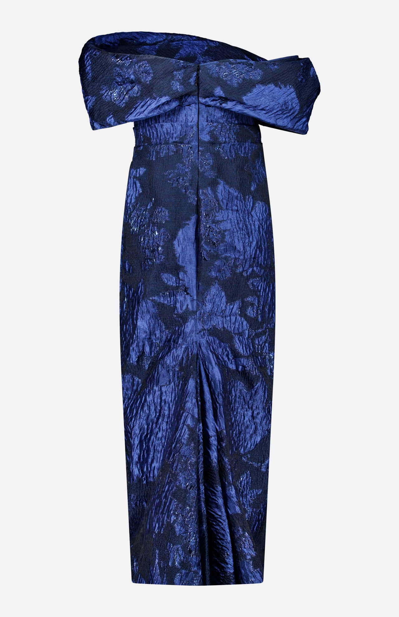 The Fil Coupe Off The Shoulder Gown by PAMELLA ROLAND features an off-the-shoulder, navy silhouette with intricate fil coupe floral patterns and a structured fold-over neckline. Displayed against a plain white background, the textured detailing and contemporary midi length highlight the refined elegance inspired by traditional gown artistry.