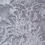 The PAMELLA ROLAND Glossy Floral Jacquard Gown features a silver-grey raised floral pattern that shimmers elegantly, making it perfect for special occasions.