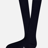 A pair of Laburnum Long 5x3 Rib Socks by PANTHERELLA in navy blue lies flat on a white background, with one sock featuring the PANTHERELLA logo in white near the toe.