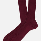 A pair of ribbed, burgundy Baffin Silk Tailored Socks by Pantherella.